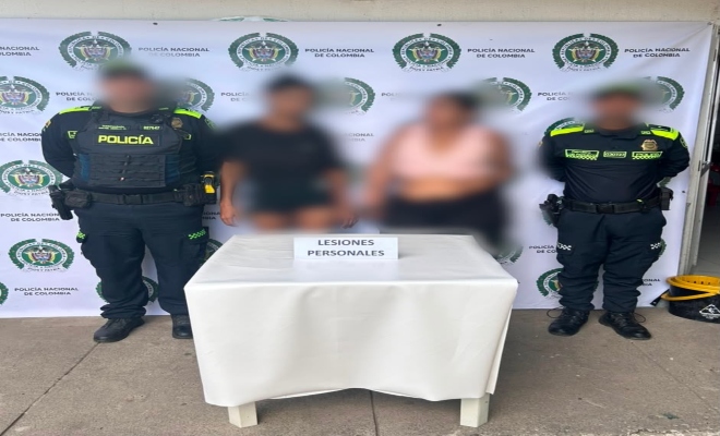 dos uniformados  con dos mujeres capturadas por el delito de lesiones personales 